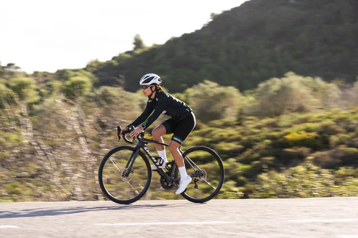 Woman cycling outdoors during an active day