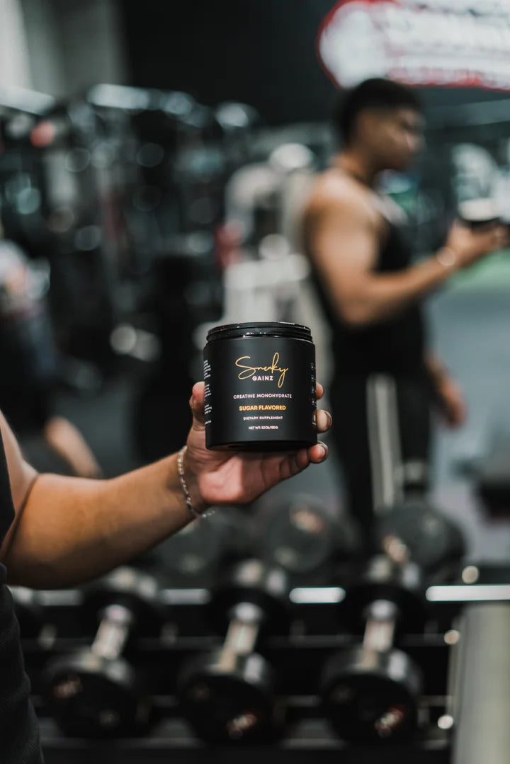 Sneaky Gainz creatine product in a gym environment
