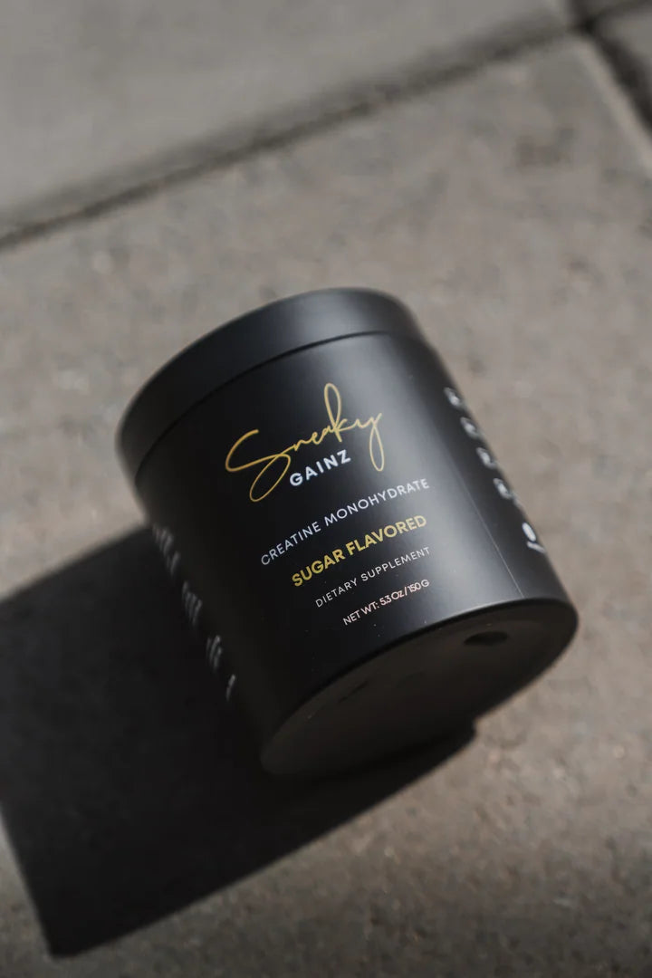 Sneaky Gainz creatine monohydrate product tub photographed outdoors